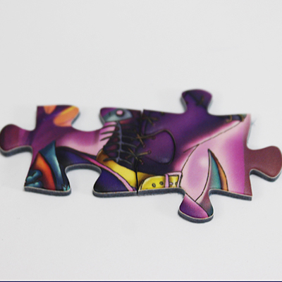 Two jigsaw pieces connected together from of 'The Witches Lair'