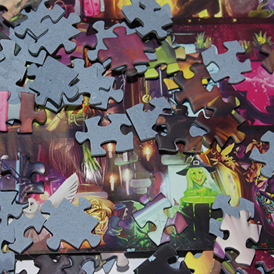 puzzle pieces onto of artwork poster